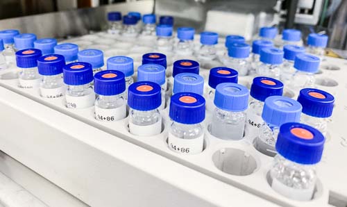 Sample bottles lined up awaiting analysis.