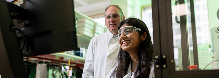 Researchers working at a computer
