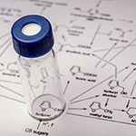 Sample tube on a diagram of molecular elements 